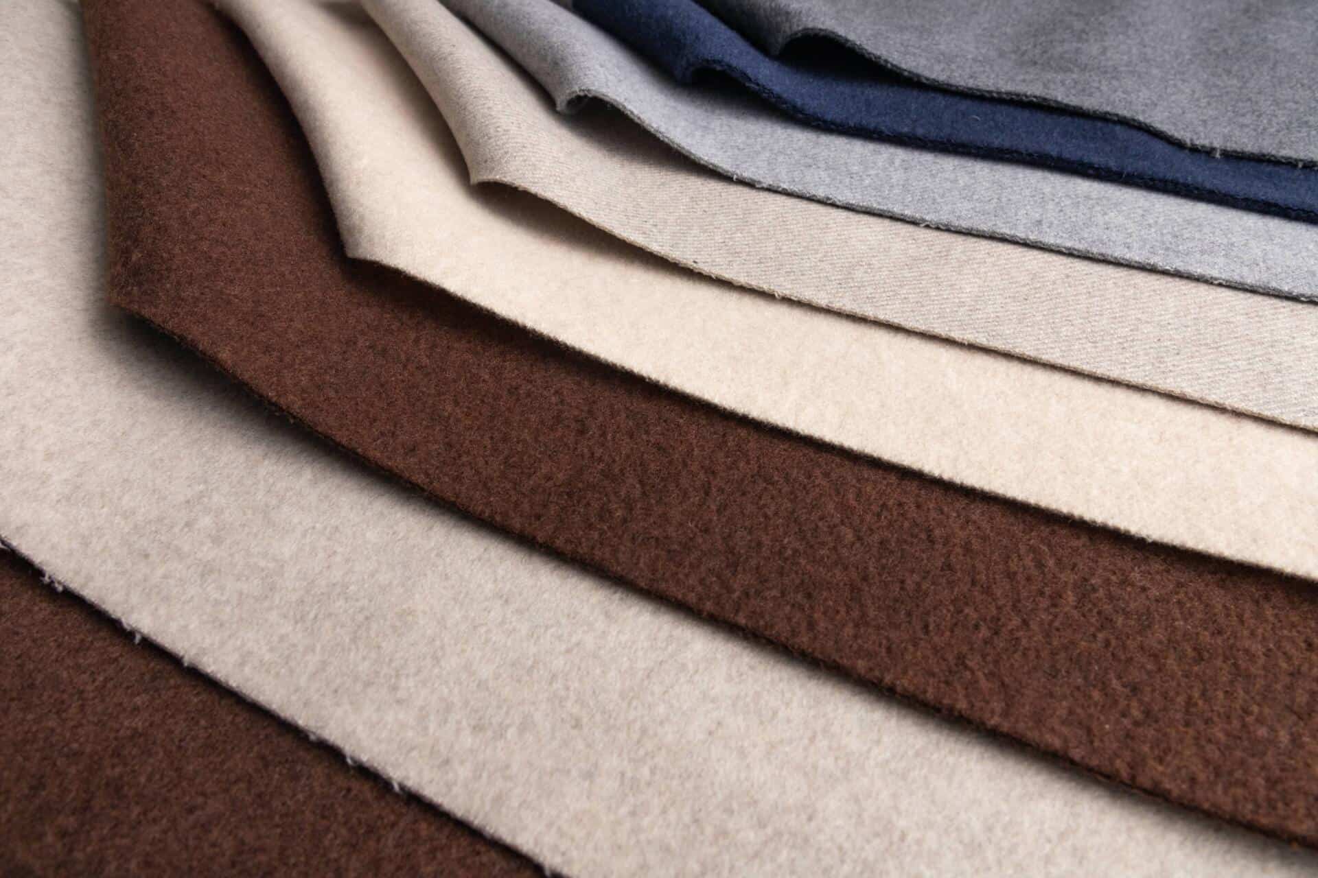 What is the difference between Worsted and Woolen textiles?